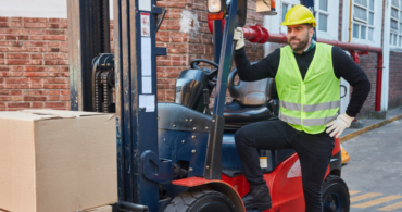 man with forklift and boxes